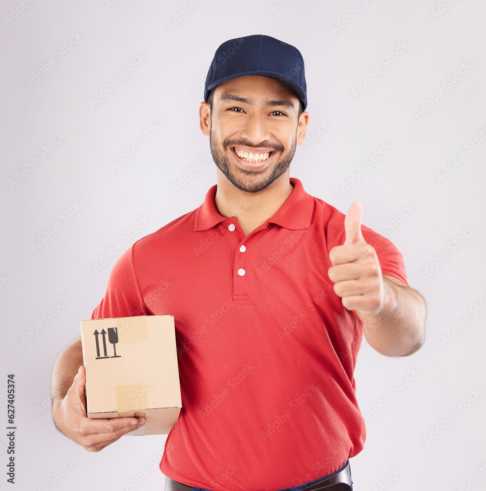 Courier man, thumbs up and studio portrait with box, delivery company and smile by white