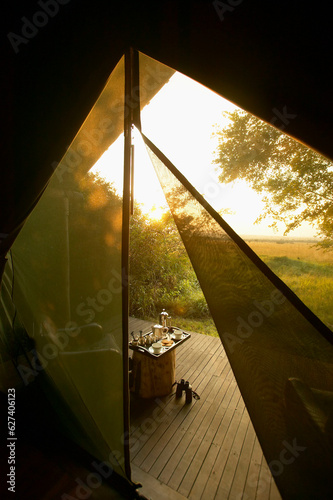 Breakfast at dawn set up outside tent at a safari camp, Bateleur Camp, Kichwa Tembo, Masai Mara National Reserve, Kenya; Kenya photo