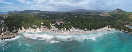 Aerial view of Cala Agulla beach in Mallorca, Spain, on a hot summer day