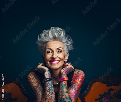 Portrait of a beautiful smiling woman in her 50s with tattoos