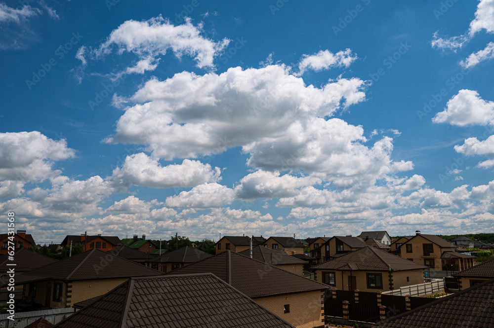 clouds over the roofs
