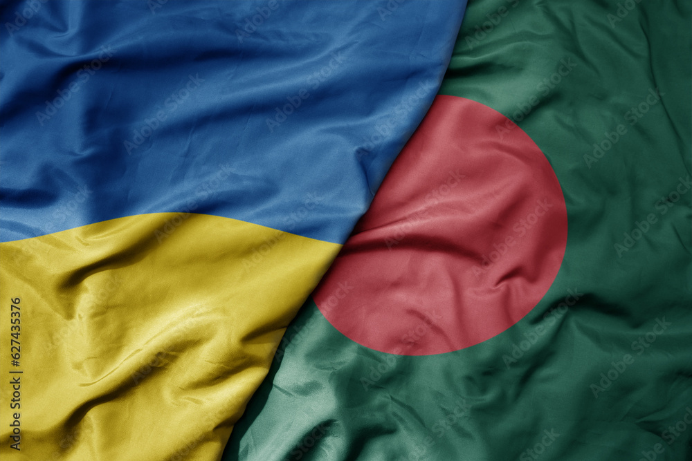 big waving national colorful flag of ukraine and national flag of bangladesh . big waving national colorful flag of ukraine and national flag of bangladesh .