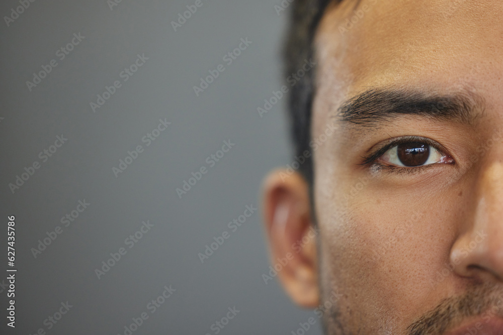 Mockup, portrait and half eyes of a man isolated on a grey background in studio. Serious, Asian and closeup face of a person with space for expression, looking handsome and a young eye on a backdrop - obrazy, fototapety, plakaty 