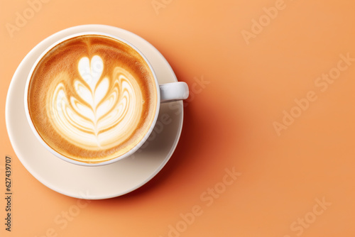 A cup of hot coffee latte art on beige background