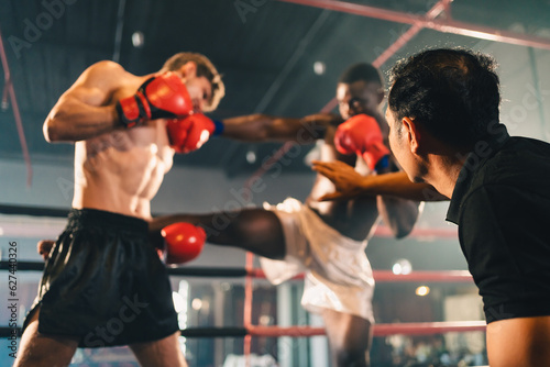 MMA or Thai Boxing match, Two professional fighters punching or boxing, Fit muscular caucasian athletes or boxers fighting, Sport competition and human emotions, Gym atmosphere background
