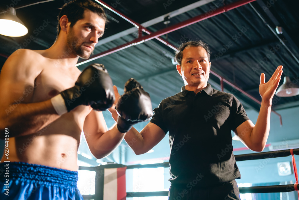 MMA or Thai Boxing match, Two professional fighters punching or boxing, Fit muscular caucasian athletes or boxers fighting, Sport competition and human emotions, Gym atmosphere background MMA or Thai Boxing match, Two professional fighters punching or boxing, Fit muscular caucasian athletes or boxers fighting, Sport competition and human emotions, Gym atmosphere background