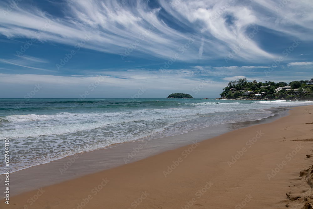 Beautiful beach on a summer day. Blue sky. Sunny day. Yellow sand on the beach.