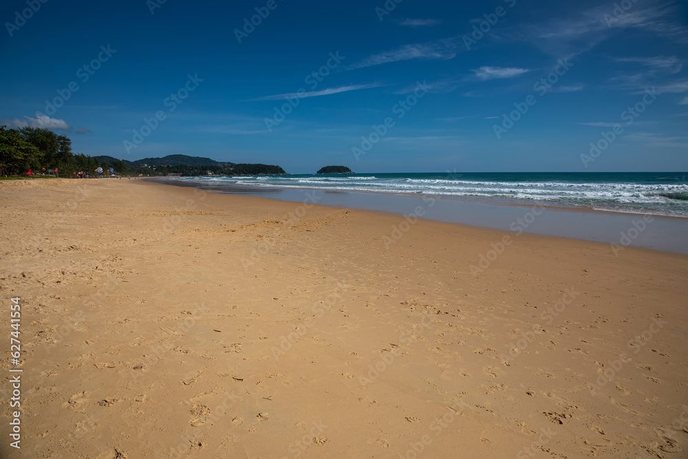 Beautiful beach on a summer day. Blue sky. Sunny day. Yellow sand on the beach.