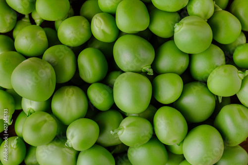 Green Pea. Green background. Peas background. Top view. Closeup. Macro shot of fresh pea.