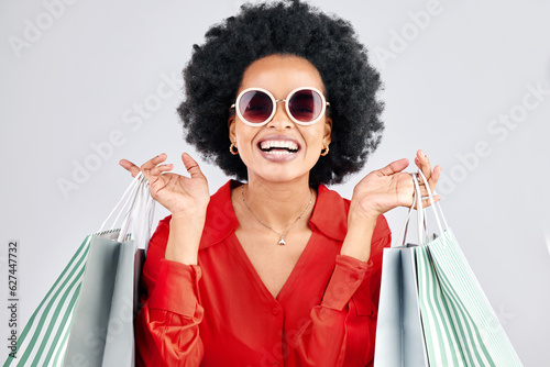 Billede på lærred Happy black woman, face and shopping bags for fashion or style against a white studio background