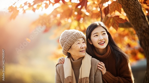 Asian woman in a caregiving role, tenderly assisting elderly individuals with kindness, empathy, and genuine care, exemplifying the essence of compassionate support. Generative AI