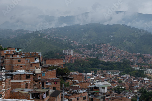 Bild auf Leinwand Aerial panoramic view of poor neighborhoods and favelas built of red brick in city's outskirt