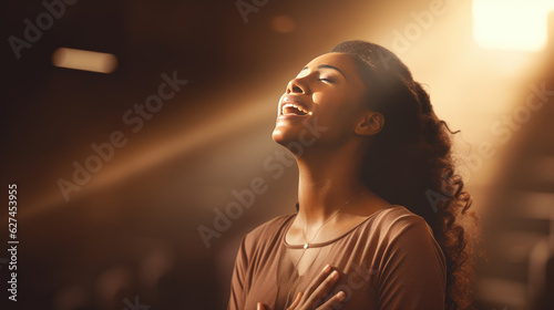 Fotografija Woman during prayer in a church.