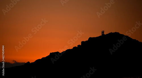 sunset over the mountain with the couple 