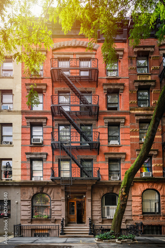 a row of brownstone buildings and in an iconic neighborhood of Manhattan, New York City.