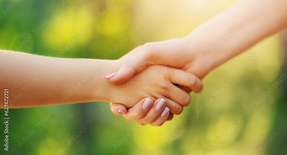 Mother holding hand of a child in her own arm. Mother holding hand of a child in her own arm.