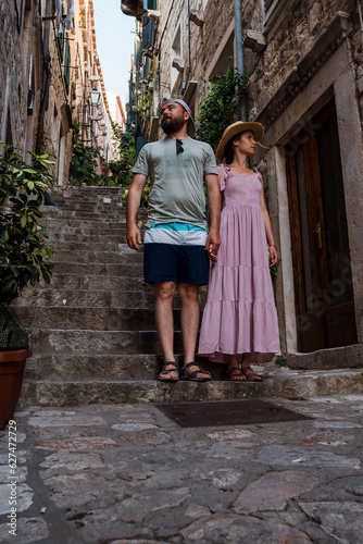 Beautiful traveler couple on the streets of Dubrovnik, Croatia