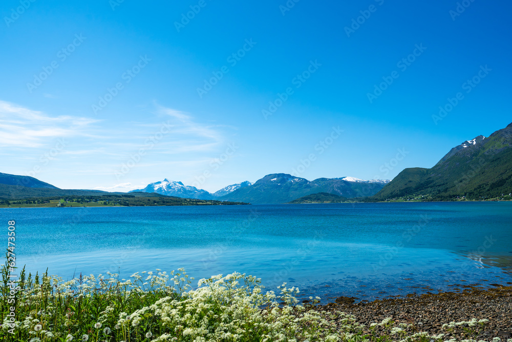 Beach, Lofoten, Norway. Stunning view point of mountains and blue sea Lofoten islands. Summer landscape and beach in Lofoten Islands. Beach, Lofoten, Norway. Stunning view point of mountains and blue sea Lofoten islands. Summer landscape and beach in Lofoten Islands.