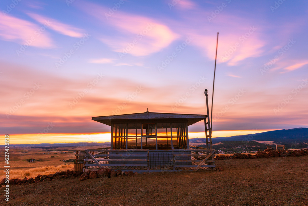 sunset over a fire lookout tower