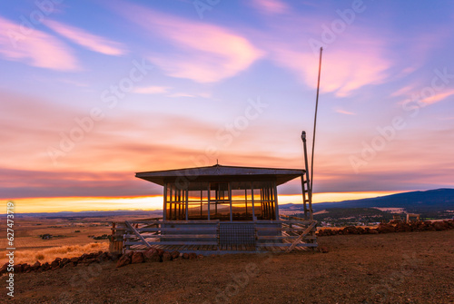 Obraz na plátně sunset over a fire lookout tower