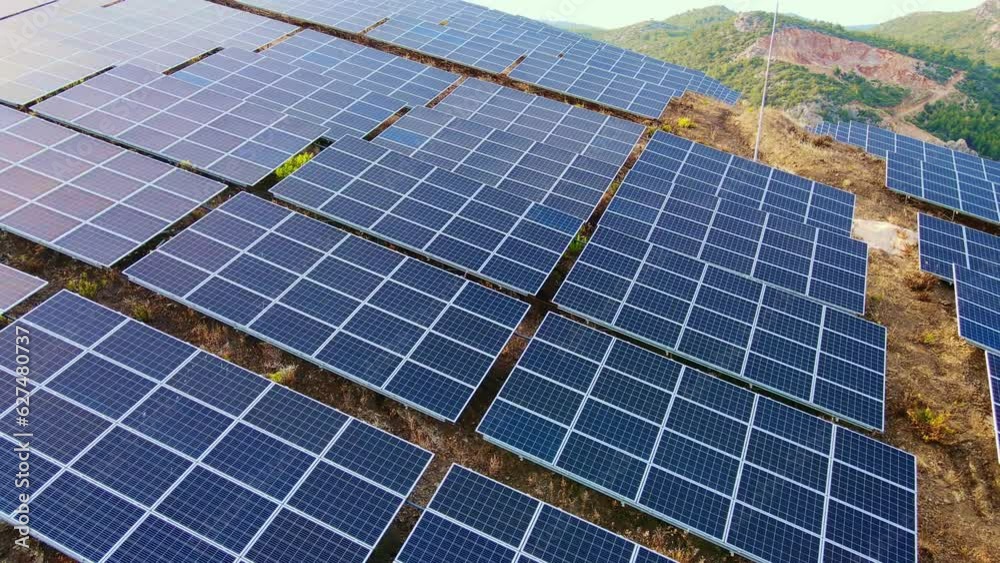Aerial view of ecology solar power station panels in the fields green energy, close-up Aerial view of ecology solar power station panels in the fields green energy, close-up