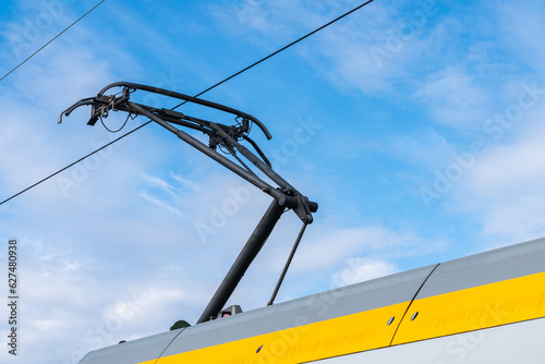 Pantograph on the train carriage roof top. Close up.