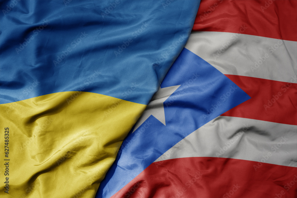big waving national colorful flag of ukraine and national flag of puerto rico . big waving national colorful flag of ukraine and national flag of puerto rico .