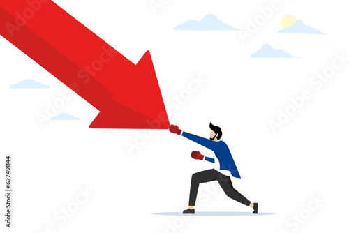 Skills concept to overcome market recession. Solve the problem in the investment crisis. Lessons About Recession. Economy Crysis. Businessman punching falling arrow to reverse uptrend.