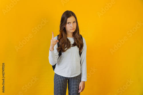 Little cute girl schoolgirl angry sad