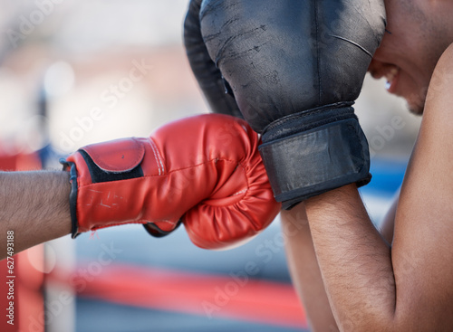 Punch, boxing gloves or men fighting in sports training, exercise or fist punching with power. Block, boxers hands or combat fighters boxing in practice or fitness workout in ring for self defense