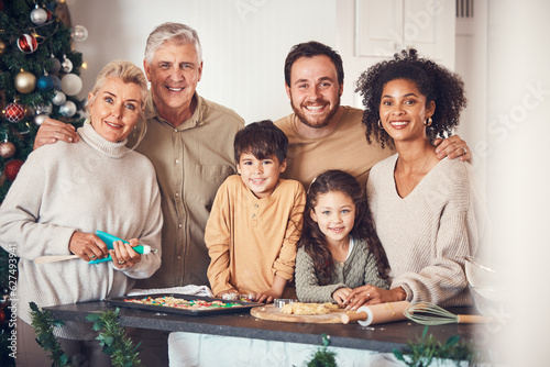 Christmas  portrait and family cooking cookies in home kitchen  bond and together. Xmas  baking food and happy face of grandparents  children and interracial parents at party  celebration or holiday