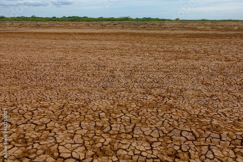 Large area of parched and cracked soil caused by long period of water shortage