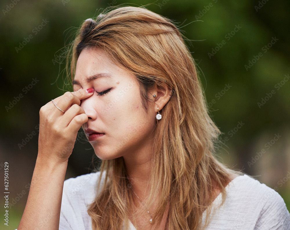 Headache, park and asian woman with stress pain in nature worried due to anxiety, fear and sad with burnout. Fatigue, sick and person or student with a problem, frustrated and confused in a crisis