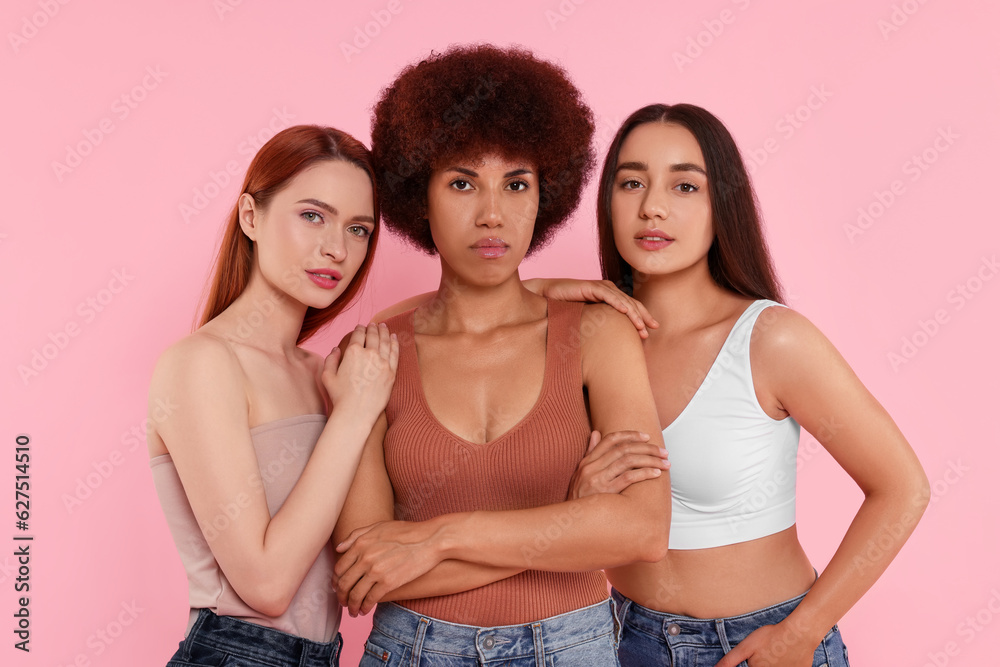 Portrait of beautiful young women on pink background Portrait of beautiful young women on pink background