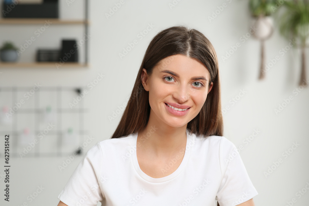 Happy woman having online video call at home, view from web camera