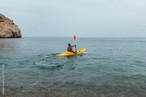 kayaking on the beach, blue water