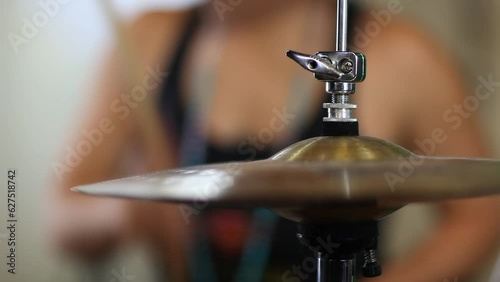 Person Playing Drums Behind Cymbal