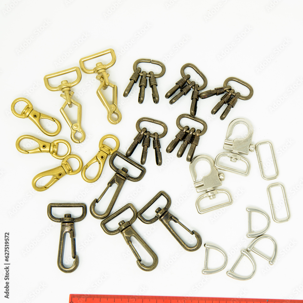 A collection of metal fittings used for leather products A collection of metal fittings used for leather products