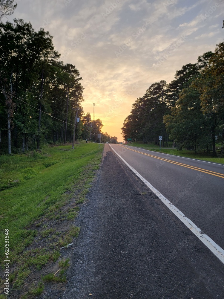 Fototapeta premium View while Walking down Highway 270, Mt. Ida, Arkansas at Sunset