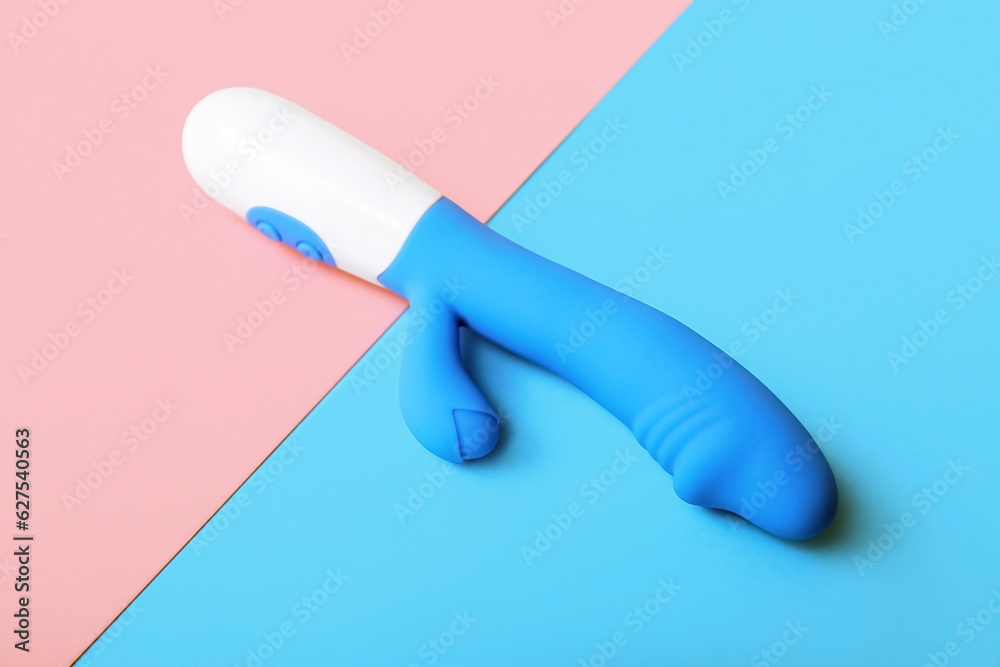 Vibrator on pink and blue background Vibrator on pink and blue background