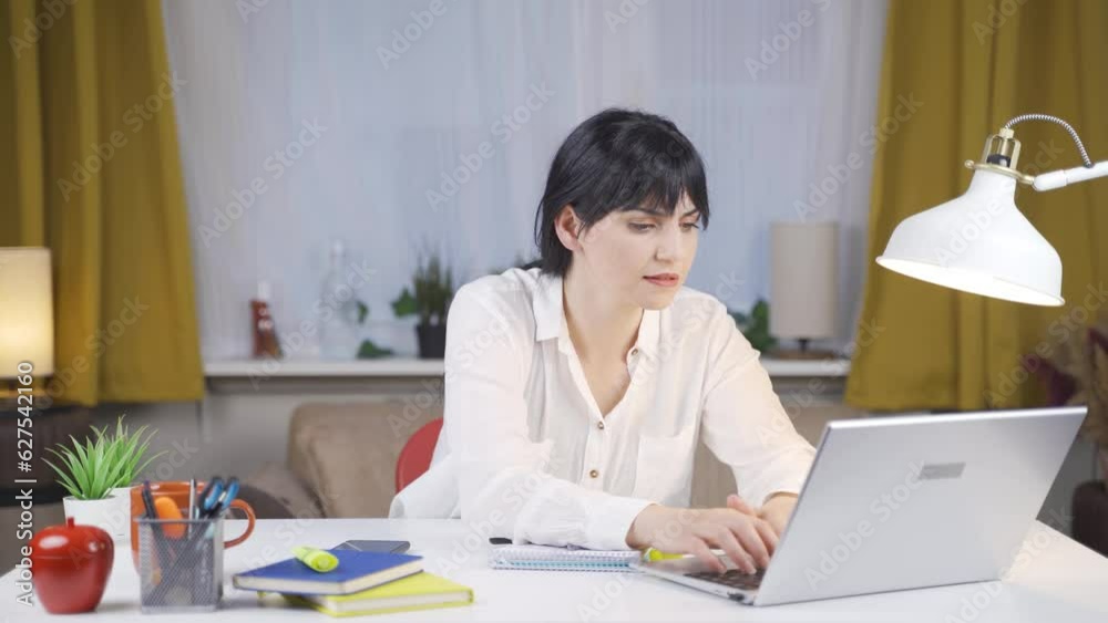 The Female student who finishes the homework is happy and peaceful. The Female student who finishes the homework is happy and peaceful.