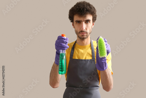 Young man with detergent an...