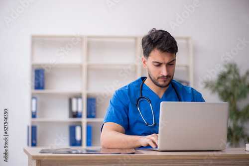 Young male doctor in telemedicine concept