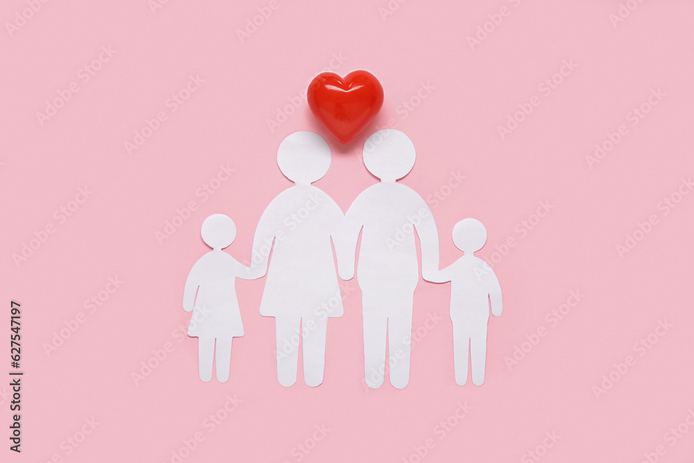 Figures of family and heart on pink background. Health insurance concept Figures of family and heart on pink background. Health insurance concept