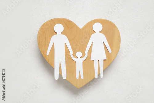 Wooden heart with figures o...