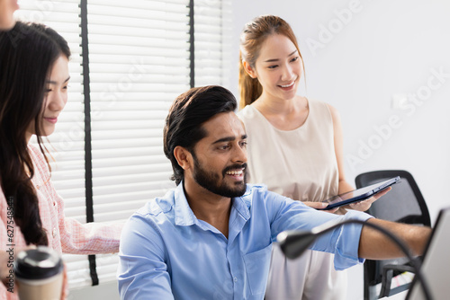 Business teamwork brainstorming strategy marketing planning. Male manager presentation with computer for female worker inside office listens to meeting report project.