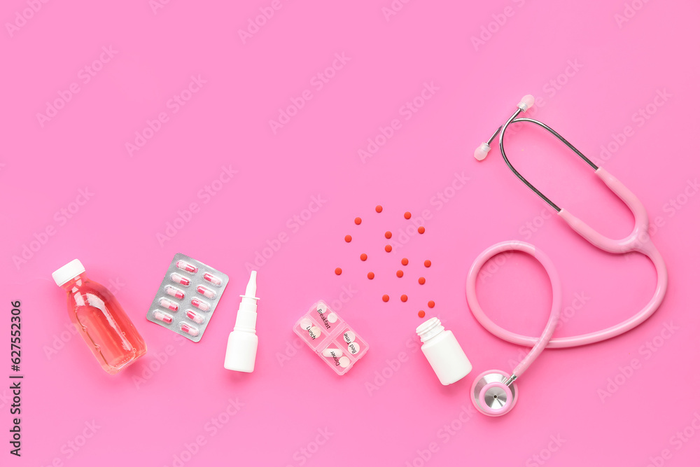 Stethoscope, pills and nasal spray on pink background Stethoscope, pills and nasal spray on pink background
