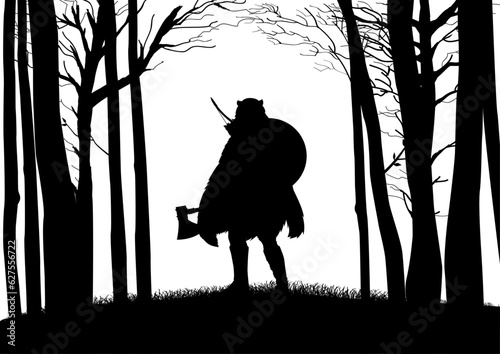 Foto Silhouette of Viking berserker wearing bear skin holding an axe in the woods, ve