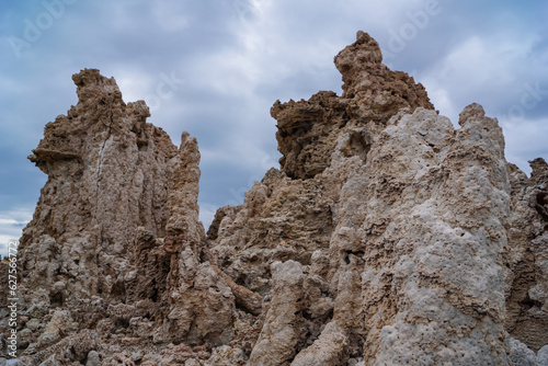 Scenic view of South Tufa rock formations at Mono Lake, near Lee Vining, Mono County, California, USA. Unique saline soda lake in Mono Basin, Sierra Nevada. Calcium carbonate minerals. Overcast