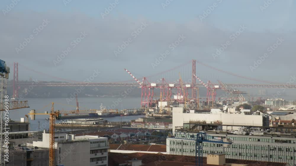 Lisbon Buildings with a View of Ponte 25 de Abril Bridge in the Background Aerial Pan Left Lisbon Buildings with a View of Ponte 25 de Abril Bridge in the Background Aerial Pan Left